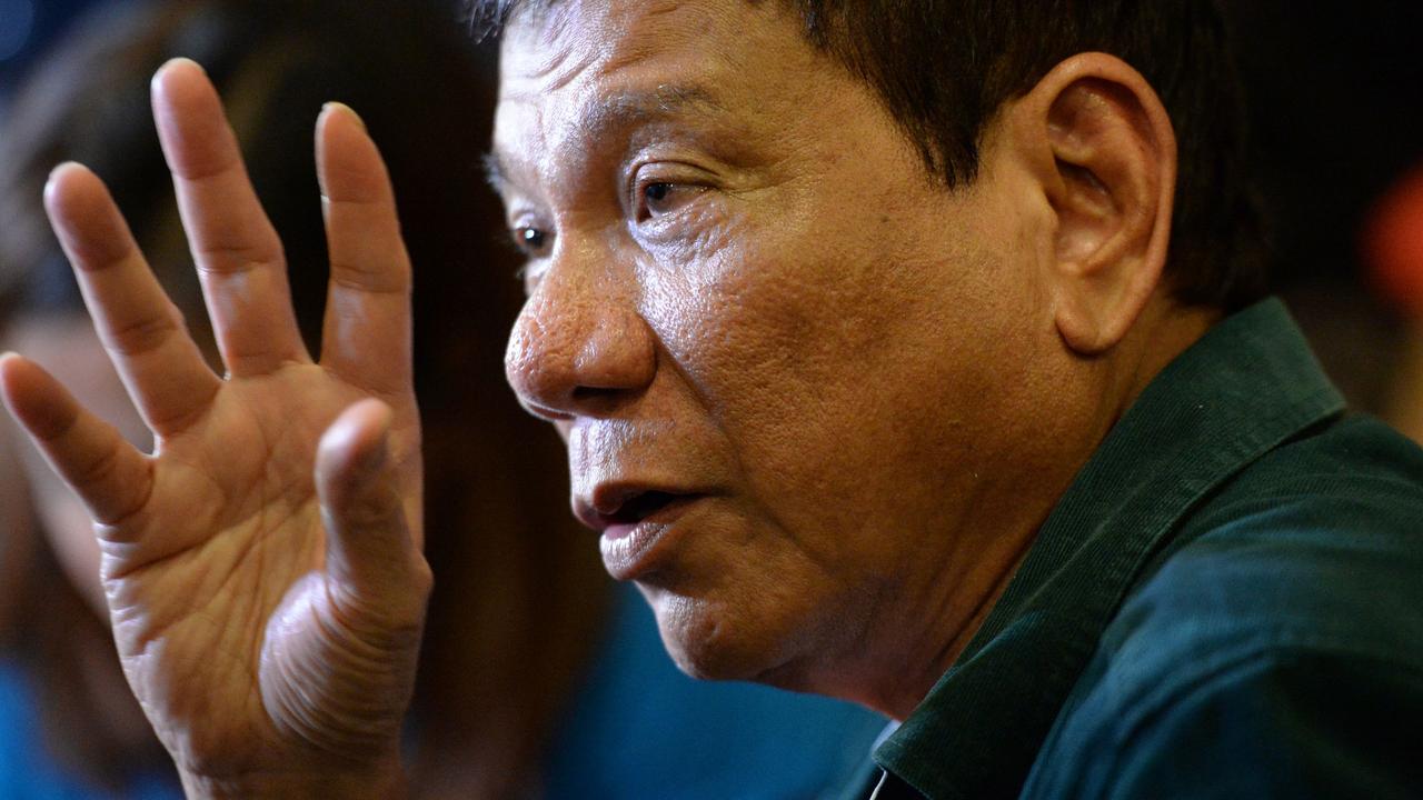 Philippines' President-elect Rodrigo Duterte speaks to the media for the first time after claiming victory in the presidential election, at a restaurant in Davao City, on the southern island of Mindanao on May 15, 2016. Duterte vowed on May 15 to reintroduce capital punishment and give security forces "shoot-to-kill" orders. / AFP PHOTO / TED ALJIBE