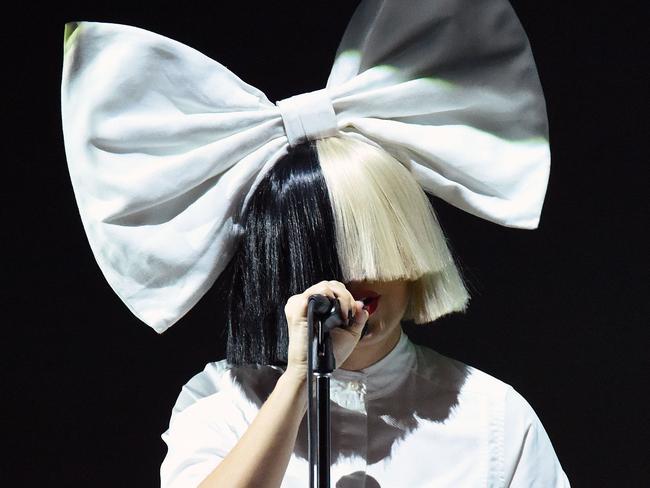 Now you Sia ... the Aussie-born star as she appears on stage. Picture: AFP/Josh Edelson
