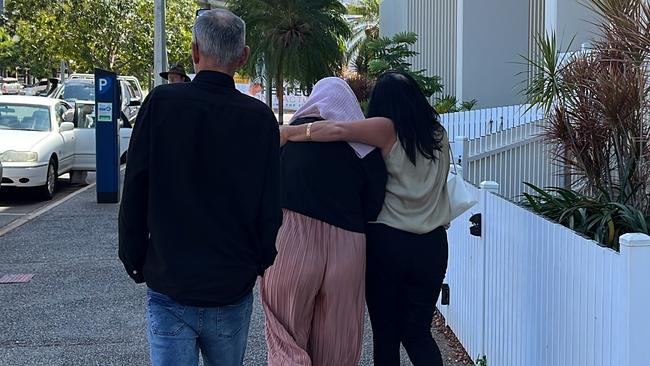 A Top End childcare centre manager Tara Eva Harding is escorted from Darwin Local Court bundled in a pink sweater by her family after facing commercial quantity drug charges.