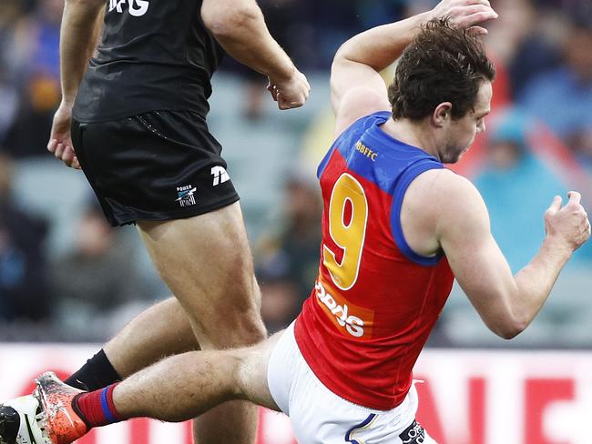 Port’s Dougal Howard got a good piece of Lachie Neale.