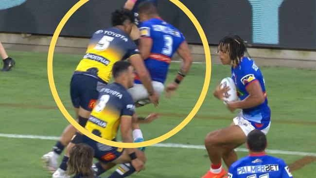 Murray Taulagi puts a late hit on Dane Gagai during the Cowboys-Knights fixture in Townsville.