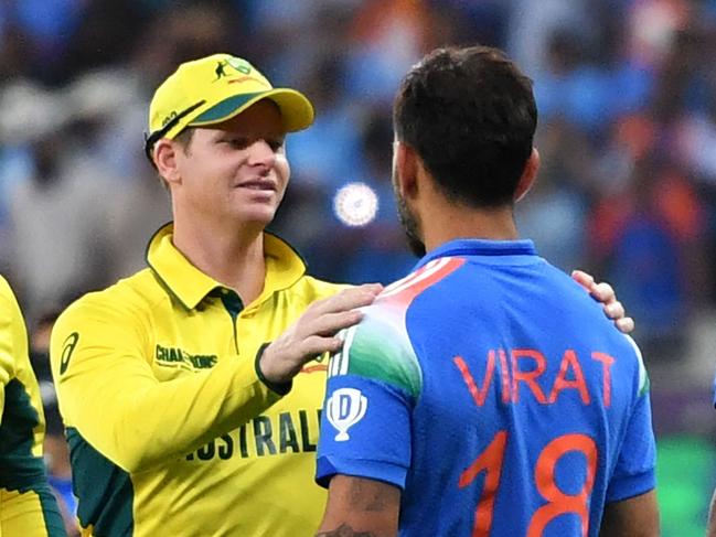 Australia's captain Steve Smith congratulates Virat Kohli on a match winning peformance in the Champions Trophy semi final in Dubai. Picture: Ryan LIM / AFP