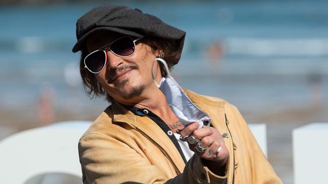 Actor Johnny Depp takes his mask off at the San Sebastian Film Festival in Spain last weekend. Picture: AFP