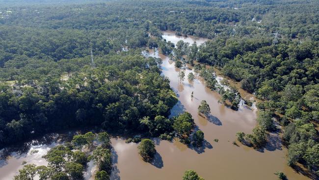 An aerial view of the scene where the body of a man was found trapped inside a vehicle in floodwaters on Cattai Ridge Road at Glenorie. Picture: Getty Images