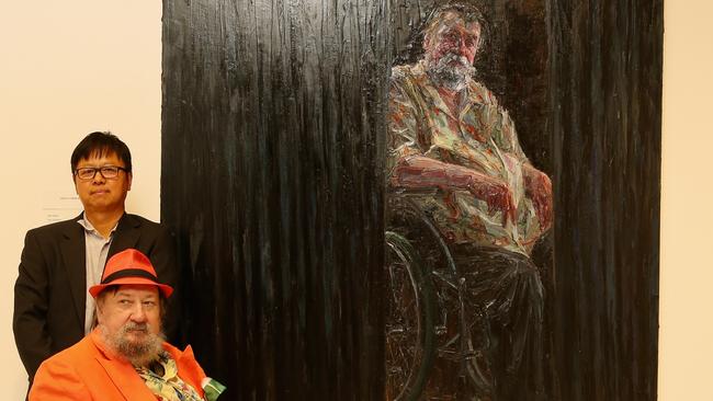 Artist Jun Chen stands behind Ray Hughes, subject of Ray Hughes, finallist in the Archibald Prize 2017. Picture: WireImage