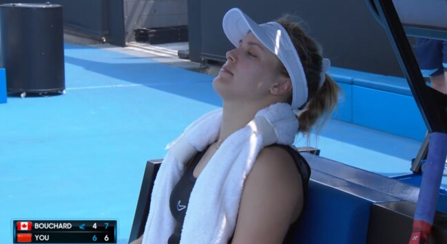 Eugenie Bouchard tries to relax at the end of a punishing second set.