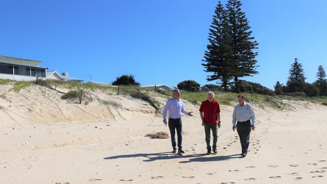 Clarence Nationals MP Chris Gulaptis, Wooli Coastal Community Protection Alliance representative and Clarence Valley Mayor Jim Simmons walking in front of the successful sand and dune nourishment project at Wooli Beach discussing its success and plans for the next beach scraping project which will provide further protection. Photo: Debbie Newton