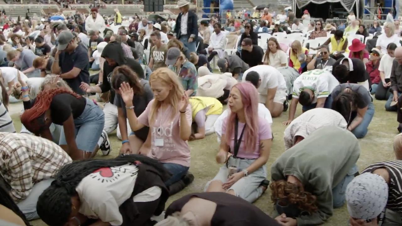 Hundreds of Christians bowing at the Awakening Australia event on Friday.