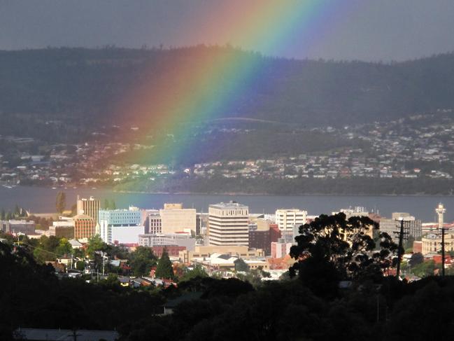 An afternoon rainbow splashes on Hobart. Picture: YOAV DANIEL BAR-NESS