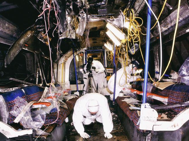 Forensic officers look for clues inside the bombed London tube carriage hit by a terrorist attack in 2005, which killed 52 people and injured more than 700.