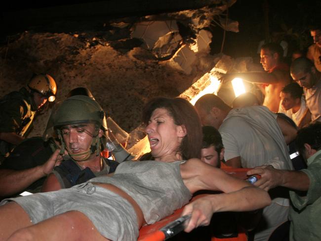 ‘Spirit of revenge’ ... an Israeli Arab woman is rescued from rubble following a Hezbollah rocket attack on Haifa in Israel, August 2006.