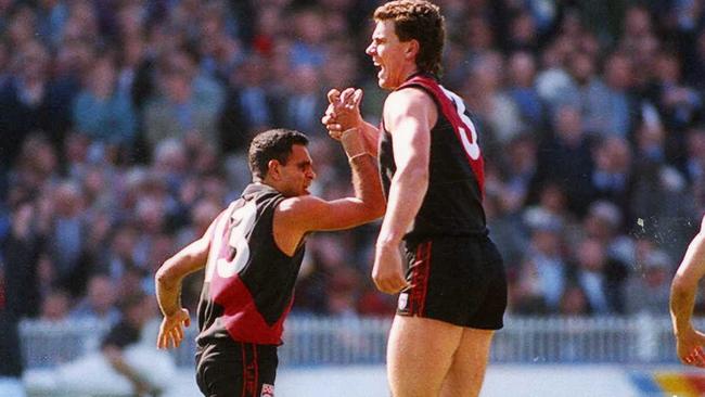 Michael Long and Paul Salmon celebrate a goal in the 1993 Grand Final.