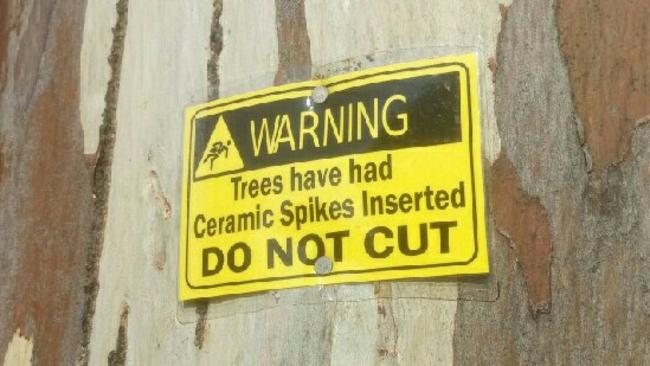 One of the warning signs on gum trees at the former Glenside Hospital site.