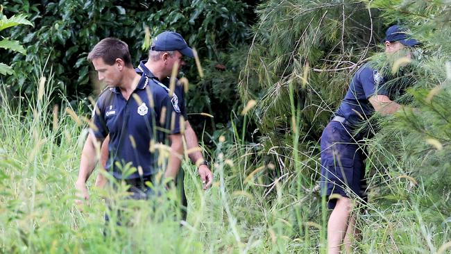 Police and SES search an Advancetown property for the body of Novy Chardon. Picture: Luke Marsden.