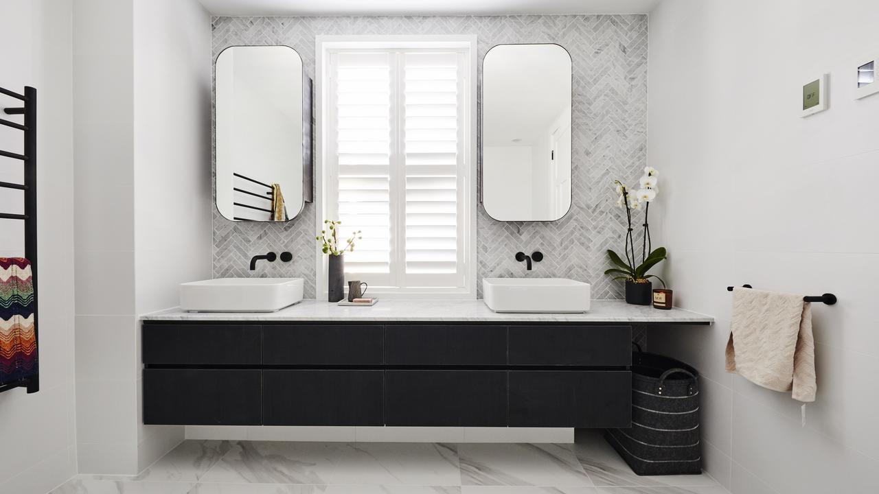 They went for a double top vanity, black fixtures and herringbone feature wall. Picture: The Block