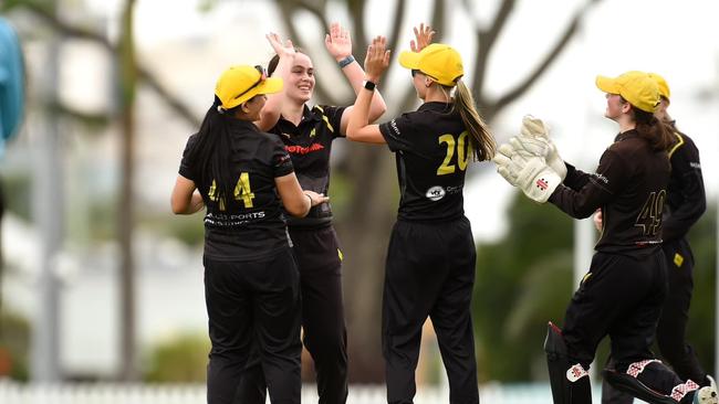 Women's women celebrate a wicket in the final.