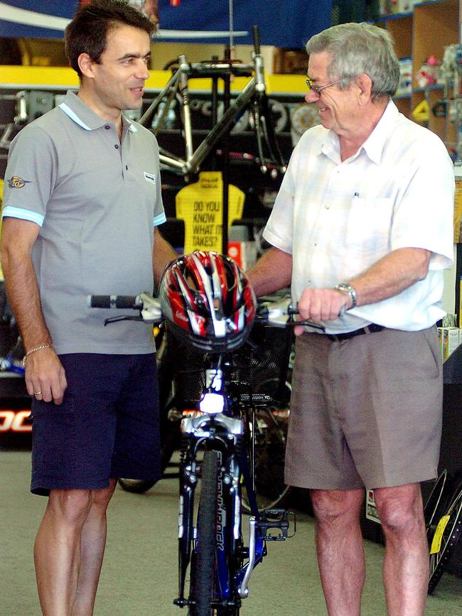 Oliver Wacek from Trinity Cycle Works with customer Barry Keys in 2005. Mr Wacek is one of the longest operating cycling proprietors in Cairns.