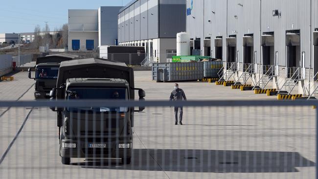 A military convoy carrying the Pfizer-BioNTech Covid-19 vaccine leaves a warehouse in Cabanillas del Campo, Spain, on Saturday. Picture: AFP