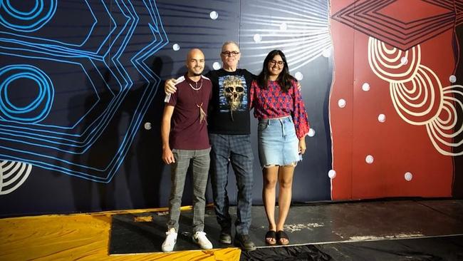 Artist Birrunga Wiradyuri, centre, with Kate Brunjes and Stevie O’Chin, standing in front of the blue-banded bee mural.