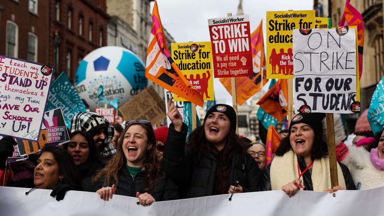 Teachers hold placards as they take part in a protest organised NEU and other affiliated trade unions in central London. Picture: Isabel Infantes / AFP