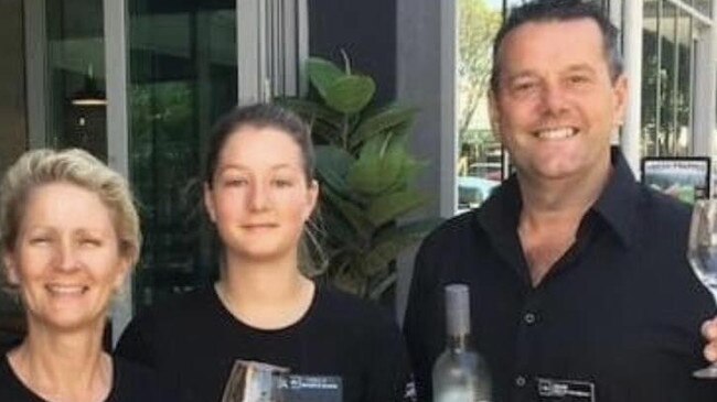 Owners of The Coffee Club at Wynnum, John and Cath Shepherd with their daughter, announcing their Wynnum shop has closed.