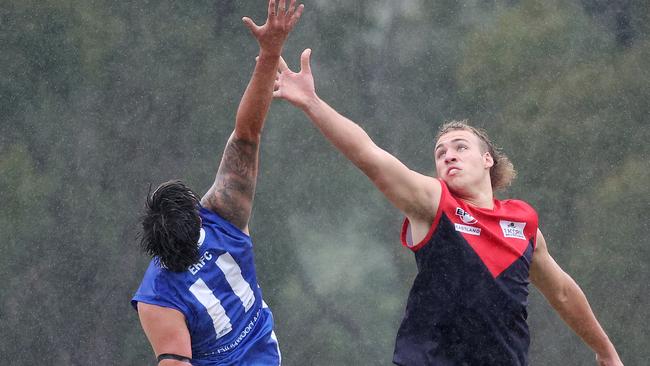 Benjamin Hickleton of East Ringwood battles with Ben Johnson of Montrose (right). Picture: George Sal