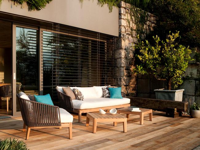 Create a relaxed atmosphere for an outdoor space with the teak Mood sofa and club chairs by Tribu. Picture: Supplied