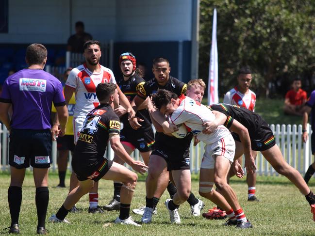 Nicholas Quinn is tackled by Luke Hanson. Picture: Sean Teuma/NewsLocal