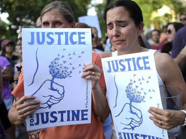 Betsy Custis, right, and others attend a march in honour of Justine Damond. Picture: AP