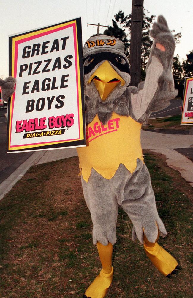 Eagle Boys Pizza Eaglet waving his sign to peak-hour motorists outside store at Chapel Hill in August 1997. Picture: Laffan Grainger