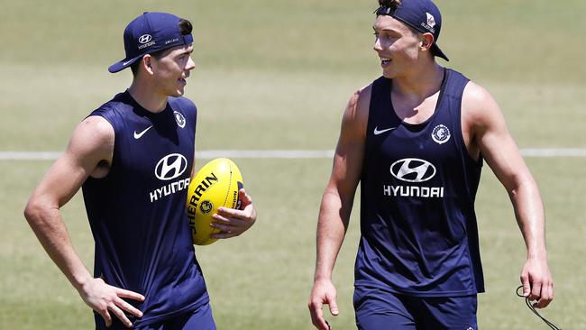 Matthew Kennedy talks with Patrick Cripps. Picture: Michael Klein