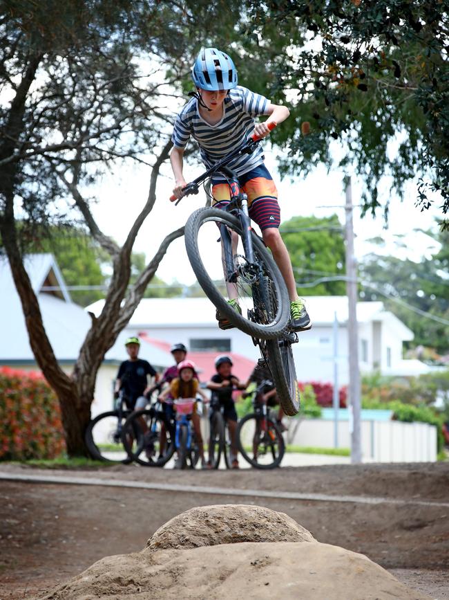 Riley Kenna getting air at his local BMX track in Caringbah. Picture: Toby Zerna