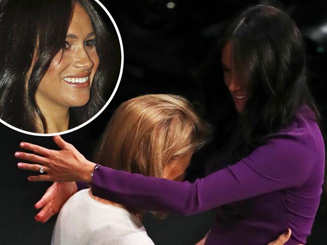 Britain's Meghan, Duchess of Sussex (R) is welcomed on state as she attends the One Young World Summit opening ceremony at the Royal Albert Hall on October 22, 2019. - The One Young World Summit is a global forum for young leaders, bringing together 2,000 young people from over 190 countries around the world to accelerate social impact. One Young World’s mission is to create the next generation of more responsible and effective leadership. (Photo by Gareth Fuller / POOL / AFP)