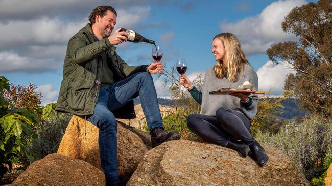 Fowles Wine owners Matt and Luise Fowles enjoy a glass of red at their Avenel venue after it avoided lockdown restrictions by a few metres. Picture: Jake Nowakowski