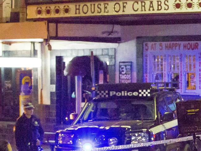 Police shut down Cleveland St in Surry Hills as part of the operation. Picture: Damian Shaw