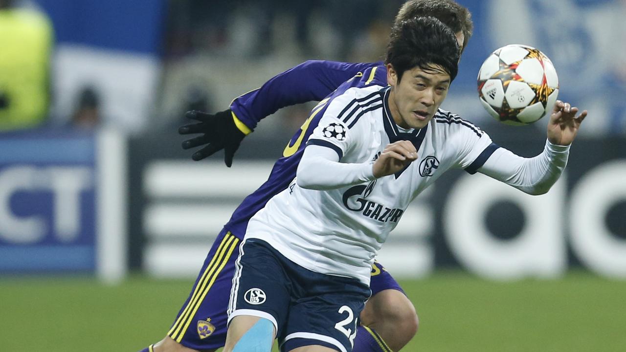 Schalke's Atsuto Uchida goes for the ball during the Champions League group G soccer match between Maribor and Schalke 04, at Ljudski Vrt stadium, in Maribor, Slovenia, Wednesday, Dec. 10, 2014.(AP Photo/Darko Bandic)