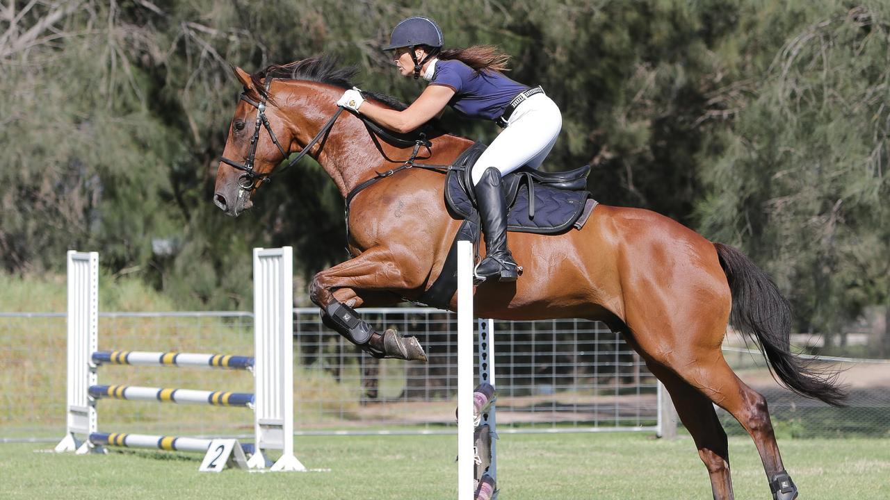 Michelle Penza competing in show jumping
