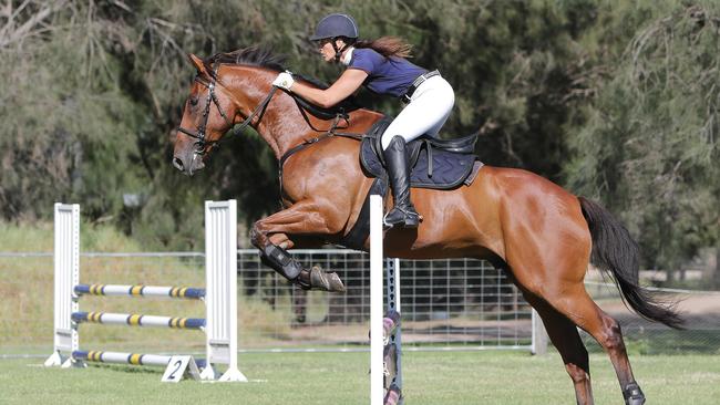 Away from racing, Jeff Penza and his wife Michelle (pictured) prepare ex-racehorses for show jumping competitions.
