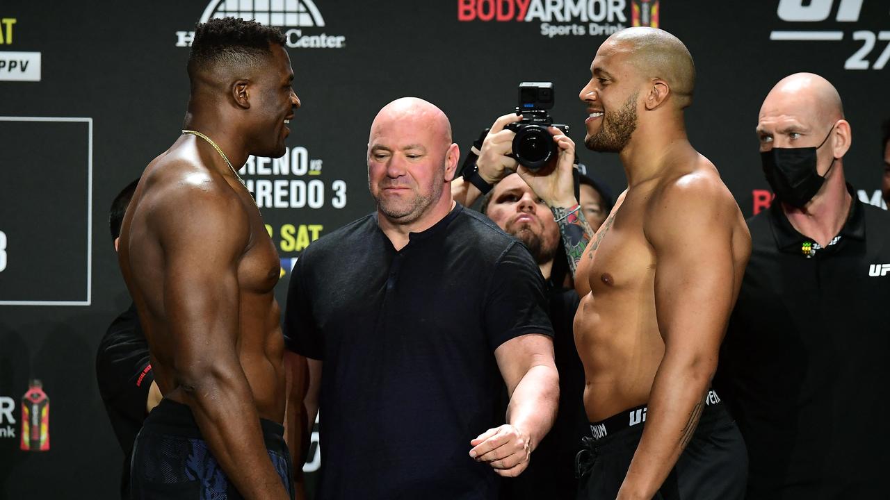 The pair won’t be all smiles when they face each other in the octagon. (Photo by FREDERIC J. BROWN / AFP)