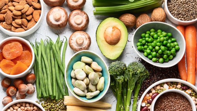 Food sources of plant based protein. Healthy diet with  legumes, dried fruit, seeds, nuts and vegetables.  Foods high in protein, antioxidants, vitamins and fiber. Top view with copy space Stock photo for AgJournal's Twenty for the 2020s feature.