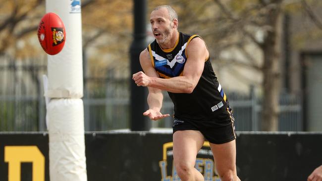 Caroline Springs star Stephen Brewer fires off a handball. Picture: Local Legends Photography