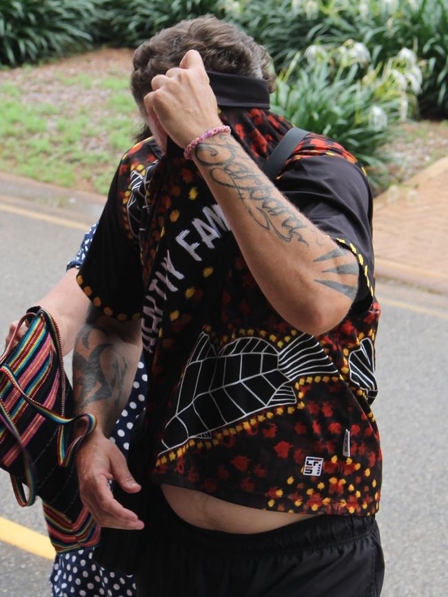 Daniel Tye Lees tries to hide from the camera outside the Supreme Court, after pleading guilty to cannabis supply. Picture: Jason Walls