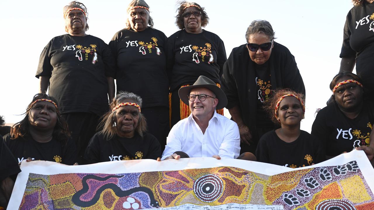 Australian Prime Minister Anthony Albanese holds the Uluru Statement From the Heart with First Nations people ahead of the 2023 Voice to parliament Referendum. Picture: NCA NewsWire / Martin Ollman