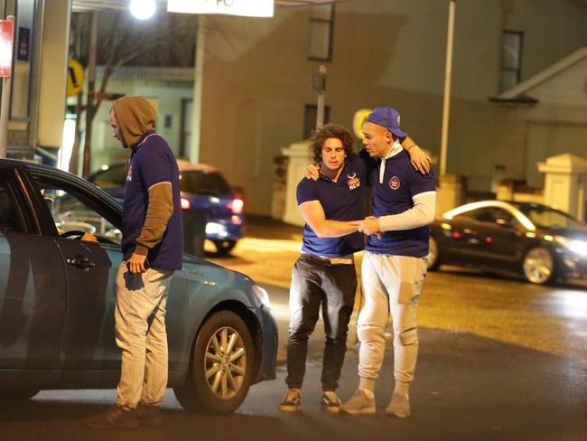A player (Centre) who seems to be drunk being carried to a uber car during the Bulldogs Mad Monday Celebrations at the Harbour View Hotel at The Rocks. Picture: Christian Gilles