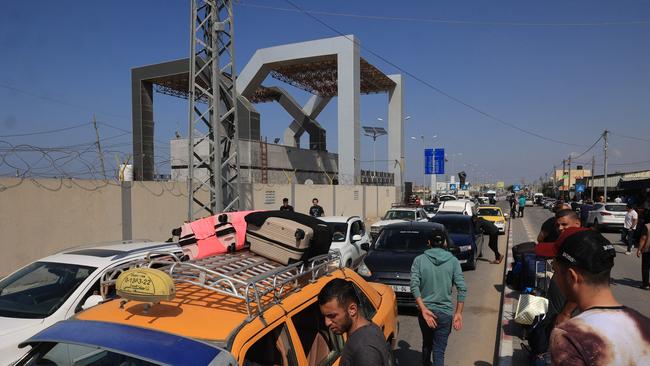 Palestinians with foreign passports hoping to flee to Egypt. Picture: Said Khatib / AFP