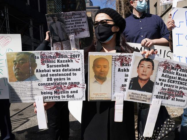 Protesters hold signs as they gather during a rally for Uighur Freedom in New York last month. Picture: AFP