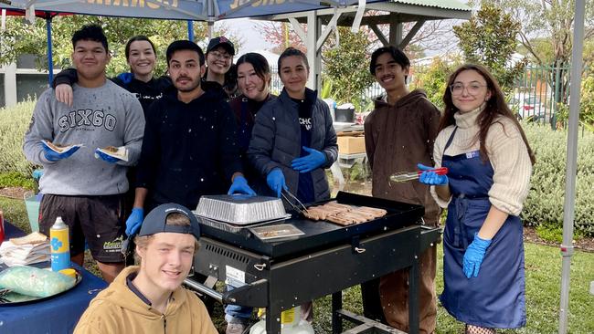 Year 12 students at Corrimal High School churning through the democracy sausages. Picture: Dylan Arvela