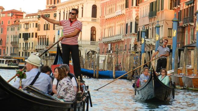Solo travellers are increasingly filling places on small group tours, such as this one in Venice.