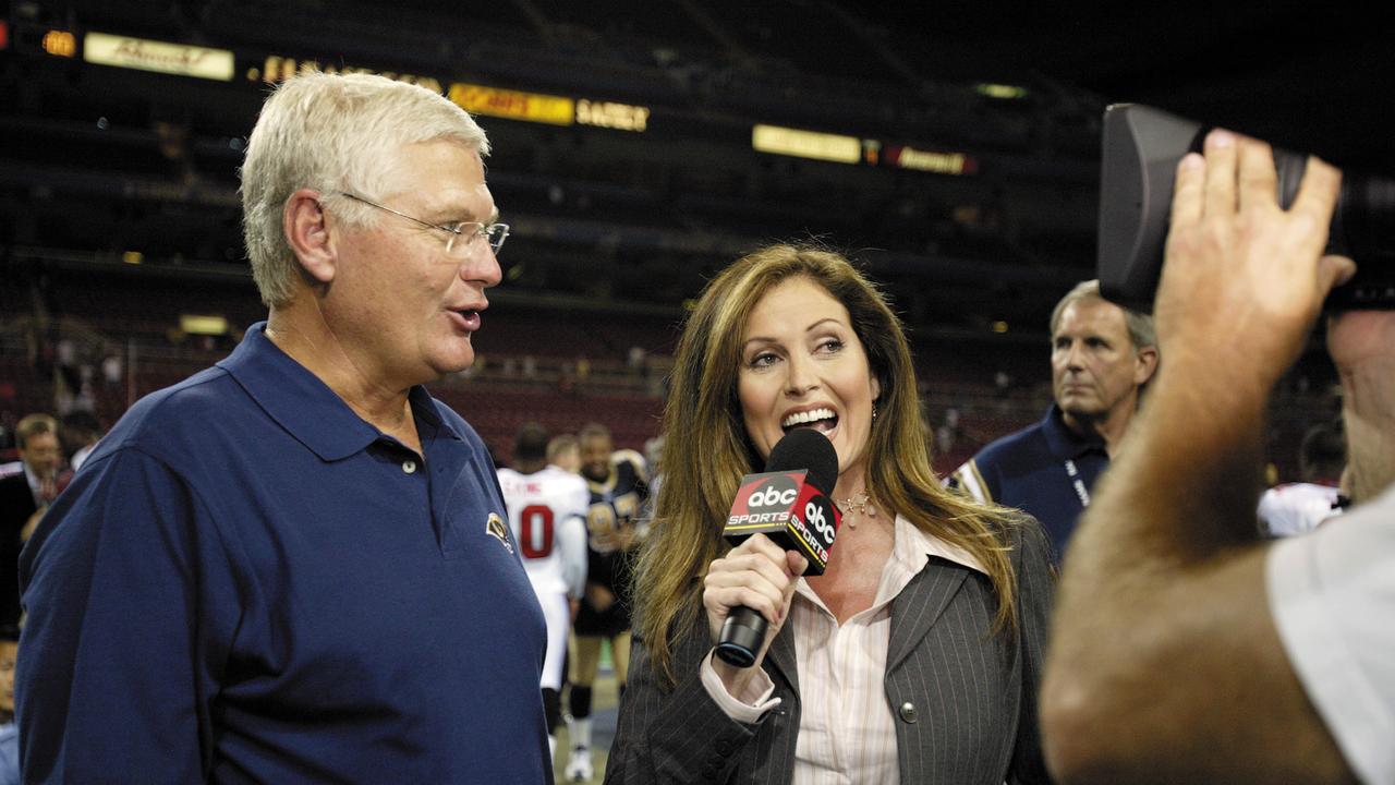 ABC sideline reporter Lisa Guerrero interviews head coach Mike Martz of the St. Louis Rams in 2003. (Photo by Elsa/Getty Images)