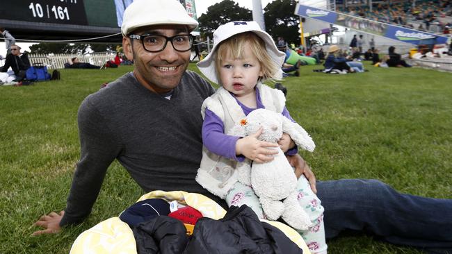 Mick Apanah, of Glenorchy, enjoying a day out at Blundstone Arena with his daughter Sophie, 2. Picture: KIM EISZELE